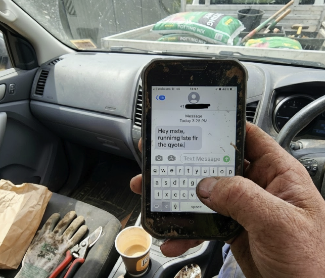 Tradie creating professional quote using voice commands on construction site